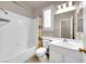 Clean bathroom with white tiles, vanity sink, and window for ample lighting at 11139 Zarod Rd, Las Vegas, NV 89135