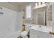 Clean bathroom featuring a shower-tub combination, white fixtures, and a vanity at 11139 Zarod Rd, Las Vegas, NV 89135