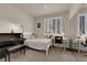 Bright bedroom with a comfortable bed, large window, and a desk for study or work at 11139 Zarod Rd, Las Vegas, NV 89135