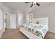 Spacious bedroom with a large window, plush carpet, and en-suite bathroom access at 11139 Zarod Rd, Las Vegas, NV 89135