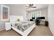 Bedroom with large windows, ceiling fan, and neutral carpet, creating a relaxing space at 11139 Zarod Rd, Las Vegas, NV 89135