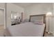 Relaxing bedroom with a comfortable bed, mirrored closet, and soft lighting at 11139 Zarod Rd, Las Vegas, NV 89135