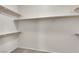 Walk-in closet with wooden shelving at 11139 Zarod Rd, Las Vegas, NV 89135
