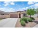 Charming single-story home featuring a well-maintained front yard and attached two-car garage at 11139 Zarod Rd, Las Vegas, NV 89135