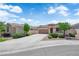 A charming house with a well-manicured lawn and lengthy drive-way provides great curb appeal at 11139 Zarod Rd, Las Vegas, NV 89135