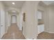 Hallway with arched openings and view of built-in storage at 11139 Zarod Rd, Las Vegas, NV 89135