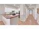 Open kitchen featuring stainless steel appliances, ample white cabinetry, and a breakfast bar at 11139 Zarod Rd, Las Vegas, NV 89135