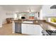 Open-concept kitchen featuring granite countertops, white cabinetry, and modern appliances at 11139 Zarod Rd, Las Vegas, NV 89135