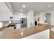 Bright kitchen featuring stainless steel appliances, light colored cabinets, and granite countertops at 11139 Zarod Rd, Las Vegas, NV 89135