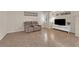 Comfortable living area featuring tiled floors and neutral tones creates a warm and inviting atmosphere at 11139 Zarod Rd, Las Vegas, NV 89135
