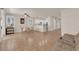Open concept living space with tile floors and neutral wall palette leading to the kitchen area at 11139 Zarod Rd, Las Vegas, NV 89135