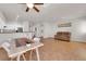 Inviting living area with tile floors, neutral paint, modern decor, and bright, natural light at 11139 Zarod Rd, Las Vegas, NV 89135