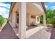 Enjoy the spacious covered patio with stone flooring and a view of the lush backyard at 11139 Zarod Rd, Las Vegas, NV 89135