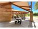 Shaded picnic area with tables and benches, perfect for outdoor gatherings and relaxation at 11139 Zarod Rd, Las Vegas, NV 89135