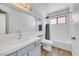 Bright bathroom with a sleek vanity, large mirror, and modern fixtures for a refreshing experience at 124 Wynntry Dr, Henderson, NV 89074