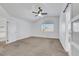Well-lit bedroom featuring vaulted ceilings, ceiling fan and a sliding barn door entrance at 124 Wynntry Dr, Henderson, NV 89074