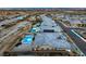 A captivating aerial view highlights upscale homes with pools and desert landscaping, all harmoniously integrated into the community at 12544 Claymore Highland Ave, Las Vegas, NV 89138