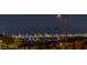 A scenic skyline view of a vibrant city at night, featuring illuminated buildings and a picturesque cityscape at 12544 Claymore Highland Ave, Las Vegas, NV 89138