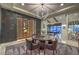 Modern dining room with wine storage, decorative screen, and comfortable seating at 12544 Claymore Highland Ave, Las Vegas, NV 89138