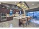 Beautiful kitchen showcasing a large island, pendant lighting, and modern stainless steel appliances at 12544 Claymore Highland Ave, Las Vegas, NV 89138