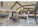 Modern kitchen and dining area boasts a large island, stainless steel appliances, and sleek finishes at 12544 Claymore Highland Ave, Las Vegas, NV 89138