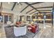 Bright, open living room featuring vaulted ceilings, wood beams, and an inviting seating arrangement at 12544 Claymore Highland Ave, Las Vegas, NV 89138