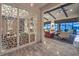 Spacious living room with modern decor, exposed beams, and seamless indoor-outdoor flow at 12544 Claymore Highland Ave, Las Vegas, NV 89138