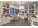 Bright office featuring custom cabinetry, large windows, and multiple desk areas at 12544 Claymore Highland Ave, Las Vegas, NV 89138