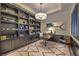 This home office boasts custom shelving, an executive desk, and refined decor at 12544 Claymore Highland Ave, Las Vegas, NV 89138