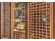 Custom wine storage with wood racking, display shelving, and recessed lighting at 12544 Claymore Highland Ave, Las Vegas, NV 89138