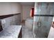 Relaxing bathroom featuring a jetted tub and glass-enclosed shower with beautiful tile work at 1340 Lucky St, Las Vegas, NV 89104
