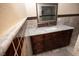 Granite topped vanity in a bright updated bathroom with accent tile at 1340 Lucky St, Las Vegas, NV 89104