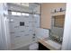 Updated bathroom featuring tile shower, granite vanity, and modern fixtures at 1340 Lucky St, Las Vegas, NV 89104