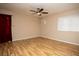 Bedroom features wood-look floors, neutral walls, and plenty of natural light at 1340 Lucky St, Las Vegas, NV 89104