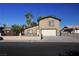 Charming two-story home with a well-maintained front yard and a spacious two-car garage, perfect for a growing Gathering at 1340 Lucky St, Las Vegas, NV 89104