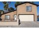 This cozy home features a well-manicured front yard, inviting entrance, and convenient two-car garage, offering both curb appeal and functionality at 1340 Lucky St, Las Vegas, NV 89104