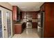 Bright kitchen with granite countertops, stainless appliances, and white tile floor at 1340 Lucky St, Las Vegas, NV 89104