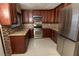 Renovated kitchen featuring stainless appliances, granite countertops, and tile flooring at 1340 Lucky St, Las Vegas, NV 89104