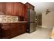 Modern kitchen with stainless steel refrigerator and ample cabinet space at 1340 Lucky St, Las Vegas, NV 89104