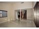 Spacious living room boasts sleek tile floors, staircase, and natural light, creating a seamless flow and comfortable environment at 1340 Lucky St, Las Vegas, NV 89104