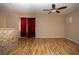 Spacious living room showcasing wood floors, neutral paint and a stone-accented pony wall at 1340 Lucky St, Las Vegas, NV 89104