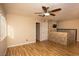 Bright living room featuring wood floors, neutral walls, and a stone-accented pony wall at 1340 Lucky St, Las Vegas, NV 89104