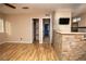Bright living room featuring wood floors, neutral walls, and a stone-accented pony wall at 1340 Lucky St, Las Vegas, NV 89104