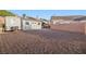 Spacious backyard featuring a shed, storage, and desert landscaping at 159 Coastal Pier Ct, Henderson, NV 89002