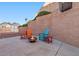 Cozy backyard fire pit area with seating and desert landscaping at 159 Coastal Pier Ct, Henderson, NV 89002
