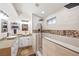 Modern bathroom with double sinks, quartz countertops, and walk-in shower at 159 Coastal Pier Ct, Henderson, NV 89002