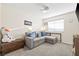 Bedroom with a large sofa and overhead fan at 159 Coastal Pier Ct, Henderson, NV 89002