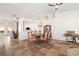Spacious dining area features stylish tiling, an open floor plan, and natural light from the backyard at 159 Coastal Pier Ct, Henderson, NV 89002