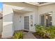 Inviting entrance to a home with a tiled portico, neutral paint, and low-maintenance yard at 159 Coastal Pier Ct, Henderson, NV 89002