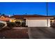 Inviting single-story home featuring a two-car garage and desert landscaping at 159 Coastal Pier Ct, Henderson, NV 89002